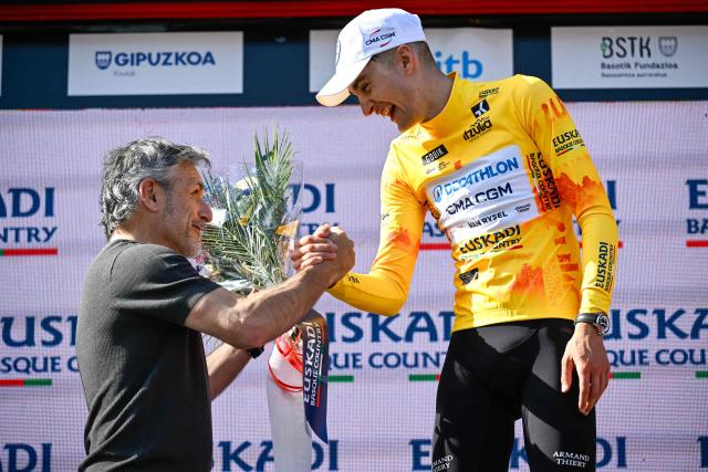 Overall race leader Team Decathlon CMA CGM's French rider Paul Seixas celebrates on the podium following the fourth stage of the Basque Country's Itzulia cycling tour, a 167.2 km race starting and finishing in Galdakao, on April 9, 2026. (Photo by ANDER GILLENEA / AFP)