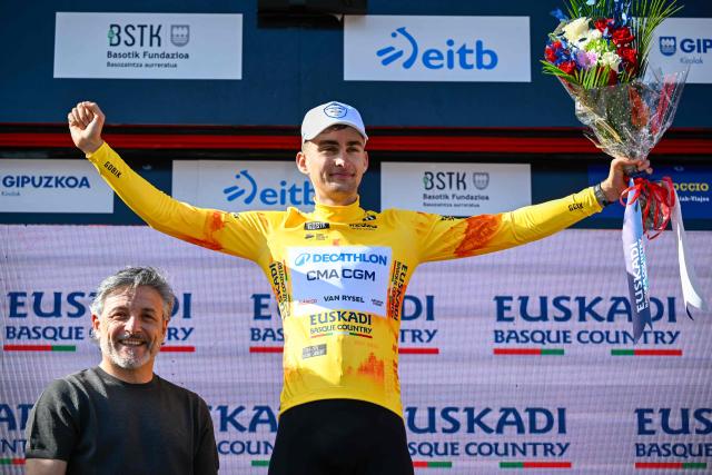 Overall race leader Team Decathlon CMA CGM's French rider Paul Seixas celebrates on the podium following the fourth stage of the Basque Country's Itzulia cycling tour, a 167.2 km race starting and finishing in Galdakao, on April 9, 2026. (Photo by ANDER GILLENEA / AFP)