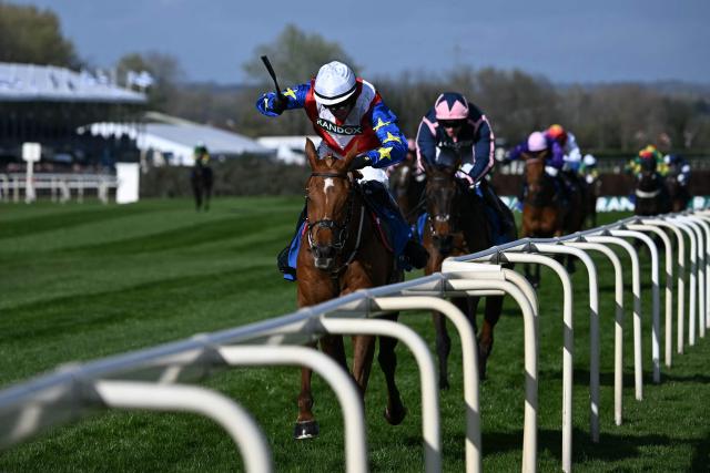Jockey Jonathan Burke wins the Red Rum Handicap Chase on Ryan's Rocket during the opening day of the Grand National Festival horse race meeting at Aintree Racecourse in Liverpool, north-west England, on April 9, 2026. (Photo by Paul ELLIS / AFP)