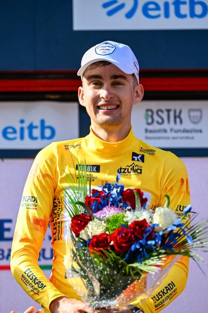 Overall race leader Team Decathlon CMA CGM's French rider Paul Seixas celebrates on the podium following the fourth stage of the Basque Country's Itzulia cycling tour, a 167.2 km race starting and finishing in Galdakao, on April 9, 2026. (Photo by ANDER GILLENEA / AFP)
