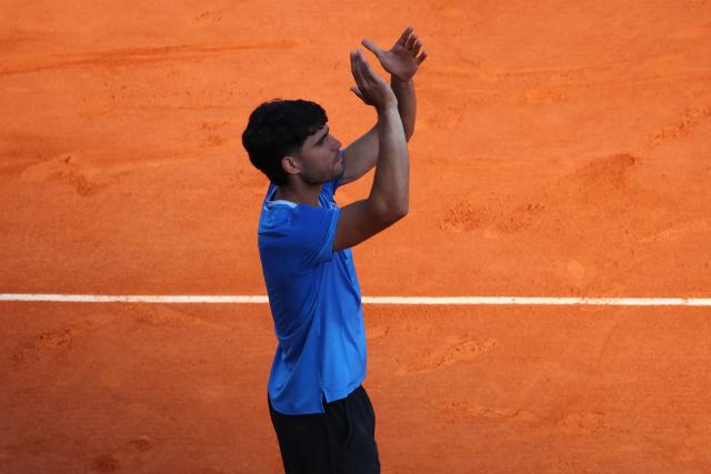 Spain's Carlos Alcaraz celebrates his victory over Argentina's Tomas Martin Etcheverry at the end of their their Monte Carlo ATP Masters Series Tournament round of 16 tennis match on Court Rainier III at the Monte-Carlo Country Club in Roquebrune-Cap-Martin, south-eastern France on April 9, 2026. (Photo by Valery HACHE / AFP)