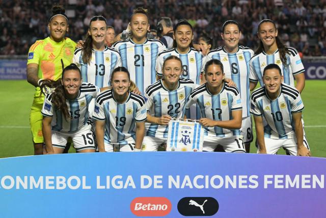 (FILES) Argentina players pose for a team photo ahead of the Conmebol Women's Nations League 2025-26 football match between Argentina and Bolivia at the Florencio Sola Stadium in Banfield, Buenos Aires province on December 2, 2025. South American women's national football teams will set out to secure early qualification for the 2027 World Cup in Brazil, starting on April 10, 2026, a triple match day of the Nations League marked by fierce competition for the top spot. (Photo by JUAN MABROMATA / AFP)