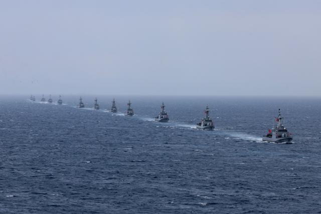 Turkey's Kilic class TCG Kilic (P-330) (R) and fast attack warships participate in the live-fire phase of the "Blue Homeland-2026" (Mavi Vatan) tactical military exercises in the eastern Mediterranean Sea, in Antalya on April 9, 2026. (Photo by Adem ALTAN / AFP)