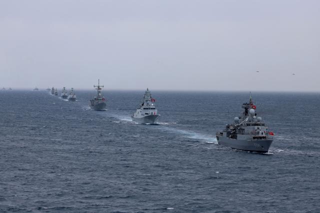 Turkey's Yavuz class TCG Turgutreis (F-241) (R), Istanbul class TCG Istanbul (P515) (2nd R) and fast attack warships participate in the live-fire phase of the "Blue Homeland-2026" (Mavi Vatan) tactical military exercises in the eastern Mediterranean Sea, in Antalya on April 9, 2026. (Photo by Adem ALTAN / AFP)
