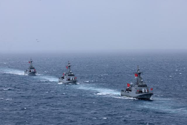 Turkey's Kilic class TCG Meltem (P334) (R), TCG Atak (P337) (C) and TCG Bora (P338) fast attack warships participate in the live-fire phase of the "Blue Homeland-2026" (Mavi Vatan) tactical military exercises in the eastern Mediterranean Sea, in Antalya on April 9, 2026. (Photo by Adem ALTAN / AFP)