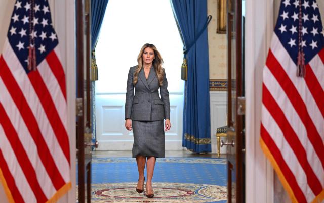 US First Lady Melania Trump arrives in the White House Cross Hall in Washington, DC, on April 9, 2026, ahead of a statement denying any links to the late convicted sex offender Jeffrey Epstein and his abuse. US First Lady Melania Trump on April 9 made a surprise on-camera statement to deny unspecified allegations about her and convicted sex offender Jeffrey Epstein. "The lies linking me with the disgraceful Jeffrey Epstein need to end today," she said. "The individuals lying about me are devoid of ethical standards, humility and respect." (Photo by Mandel NGAN / AFP)