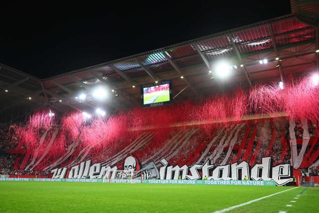 Fans of Freiburg make a performance ahead the UEFA Europa League Quarter final First Leg football match between SC Freiburg and Celta Vigo in Freiburg, on April 9, 2026. (Photo by Silas STEIN / AFP)
