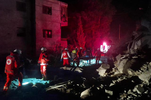 First responders look for survivors at the site of an Israeli airstrike that targeted the southern Lebanese village of Choukine on April 9, 2026. A Hezbollah lawmaker on April 9 reiterated his group's rejection of any direct negotiations between Lebanon and Israel, after Israeli Prime Minister Benjamin Netanyahu said he had ordered his cabinet to begin talks with Beirut. (Photo by Abbas FAKIH / AFP)