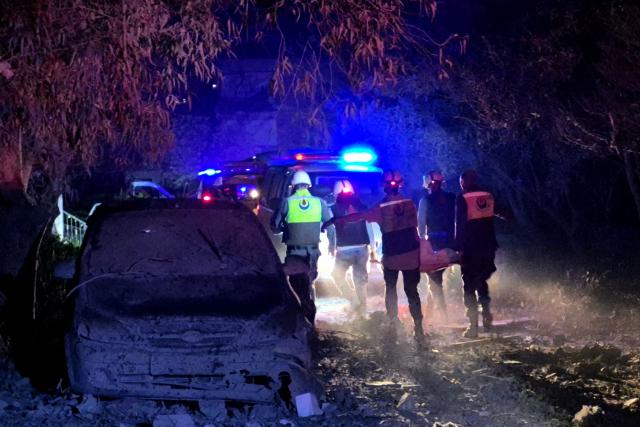 First responders evacuate a body from to the site of an Israeli airstrike that targeted the southern Lebanese village of Choukine on April 9, 2026. A Hezbollah lawmaker on April 9 reiterated his group's rejection of any direct negotiations between Lebanon and Israel, after Israeli Prime Minister Benjamin Netanyahu said he had ordered his cabinet to begin talks with Beirut. (Photo by Abbas FAKIH / AFP)