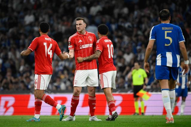 From (L-R) Nottingham Forest's Swiss midfielder #11 Dan Ndoye, Nottingham Forest's New Zealand striker #11 Chris Wood, and Nottingham Forest's English midfielder #10 Morgan Gibbs-White celebrate their team's first goal which was ruled as an own goal by Porto during the UEFA Europa League quarter final first leg football match between FC Porto and Nottingham forest at Dragao Stadium in Porto, on April 9, 2026. (Photo by Miguel RIOPA / AFP)