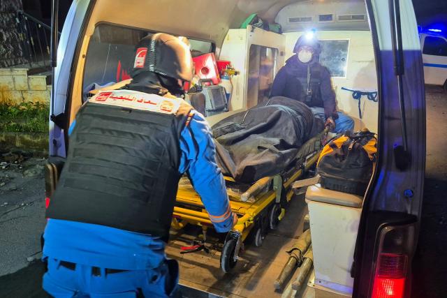 First responders evacuate a body from to the site of an Israeli airstrike that targeted the southern Lebanese village of Choukine on April 9, 2026. A Hezbollah lawmaker on April 9 reiterated his group's rejection of any direct negotiations between Lebanon and Israel, after Israeli Prime Minister Benjamin Netanyahu said he had ordered his cabinet to begin talks with Beirut. (Photo by Abbas FAKIH / AFP)