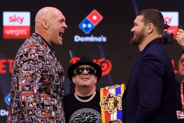 Britain's two-time former world heavyweight champion Tyson Fury faces off with Russia's Arslanbek Makhmudov during a press conference in central London on April 9, 2026, ahead of their heavyweight boxing match on April 11. (Photo by Toby Shepheard / AFP)