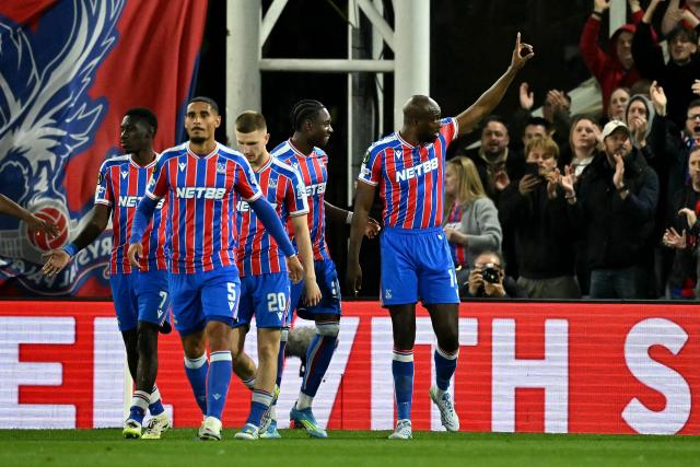 Crystal Palace's French striker #14 Jean-Philippe Mateta (R) celebrates scoring the team's first goal during the UEFA Conference quarter final first-leg football match between Crystal Palace and ACF Fiorentina at Selhurst Park in London on April 9, 2026. (Photo by Ben STANSALL / AFP)