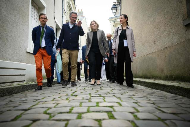 French Culture Minister Catherine Pegard (2ndR) arrives for the inauguration of a gallery designed by Japanese architect Kengo Kuma to protect the portal of Saint-Maurice Cathedral, in Angers, western France, on April 9, 2026. (Photo by Loic VENANCE / AFP)