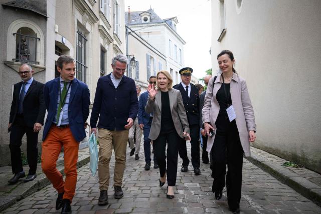 French Culture Minister Catherine Pegard (2ndR) arrives for the inauguration of a gallery designed by Japanese architect Kengo Kuma to protect the portal of Saint-Maurice Cathedral, in Angers, western France, on April 9, 2026. (Photo by Loic VENANCE / AFP)
