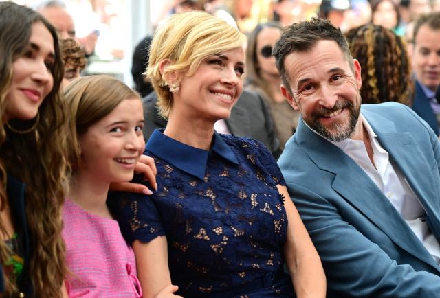US actor Noah Wyle sits with his wife Sara Wells and daughters Auden Wyle (L) and Frances Harper Wyle (2L) during his Walk of Fame star ceremony in Hollywood, California on April 9, 2026. (Photo by Frederic J. BROWN / AFP)