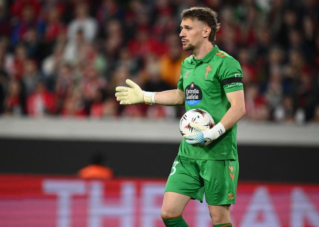 Celta Vigo's Romanian goalkeeper #13 Ionut Andrei Radu holds the ball during the UEFA Europa League Quarter final First Leg football match between SC Freiburg and Celta Vigo in Freiburg, on April 9, 2026. (Photo by Silas STEIN / AFP)