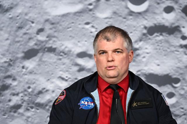 NASA’s Artemis II flight director Jeff Radigan speaks during a status briefing of the Artemis II crewed lunar mission, on April 9, 2026, at the Johnson Space Center in Houston, Texas. After completing their lunar flyby -- breaking the record for distance from Earth -- the Artemis II crew is bound for home, with splashdown due in the Pacific off the coast of California late April 10. (Photo by RONALDO SCHEMIDT / AFP)