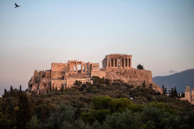 (FILES) A photograph shows the Parthenon Temple at the top of the Acropolis hill in Athens on November 15, 2022. From 2022 to 2025, scientists at the National University of Athens and the National Hellenic Research Foundation examined past and present climate and geological conditions at the 19 sites, looking at prior damage to help determine future vulnerability to extreme events. The sites under scrutiny include Olympia, habitually threatened by forest fires, the ancient theatre of Delphi, where rockslides are a concern. (Photo by Angelos Tzortzinis / AFP)