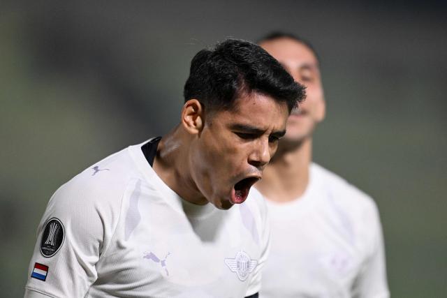 Libertad's forward #10 Lorenzo Melgarejo celebrates scoring his team's first goal during the Copa Libertadores group stage football match between Venezuela's Universidad Central and Paraguay's Libertad at the Olimpico de la UCV stadium in Caracas, on April 9, 2026. (Photo by Juan BARRETO / AFP)