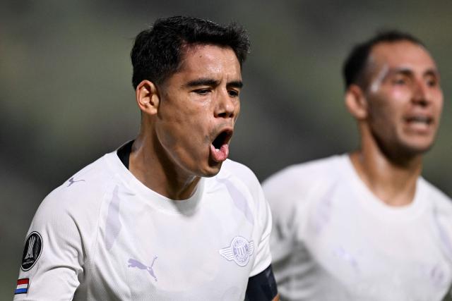 Libertad's forward #10 Lorenzo Melgarejo celebrates scoring his team's first goal during the Copa Libertadores group stage football match between Venezuela's Universidad Central and Paraguay's Libertad at the Olimpico de la UCV stadium in Caracas, on April 9, 2026. (Photo by Juan BARRETO / AFP)