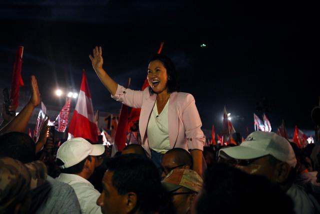Peru's presidential candidate Keiko Fujimori, for the Fuerza Popular party, waves to supporters during her closing campaign rally at Villa el Salvador in Lima on April 9, 2026. Peru will hold presidential elections on April 12. (Photo by ERNESTO BENAVIDES / AFP)