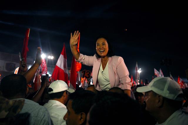Peru's presidential candidate Keiko Fujimori, for the Fuerza Popular party, waves to supporters during her closing campaign rally at Villa el Salvador in Lima on April 9, 2026. Peru will hold presidential elections on April 12. (Photo by ERNESTO BENAVIDES / AFP)