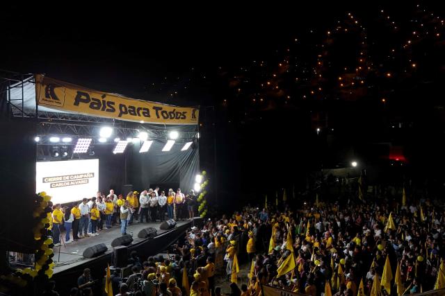 This aerial view shows Peru's presidential candidate Carlos Alvarez, for the Pais Para Todos party, speaking to supporters during his closing campaign rally in Lima on April 9, 2026. Peru will hold presidential elections on April 12. (Photo by Connie FRANCE / AFP)