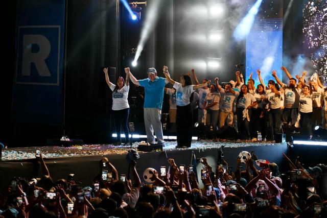 Peru's presidential candidate Rafael Lopez Aliaga (C), for the Renovacion Popular party, greets supporters during his closing campaign rally in Lima on April 9, 2026. Peru will hold presidential elections on April 12. (Photo by Luis ROBAYO / AFP)