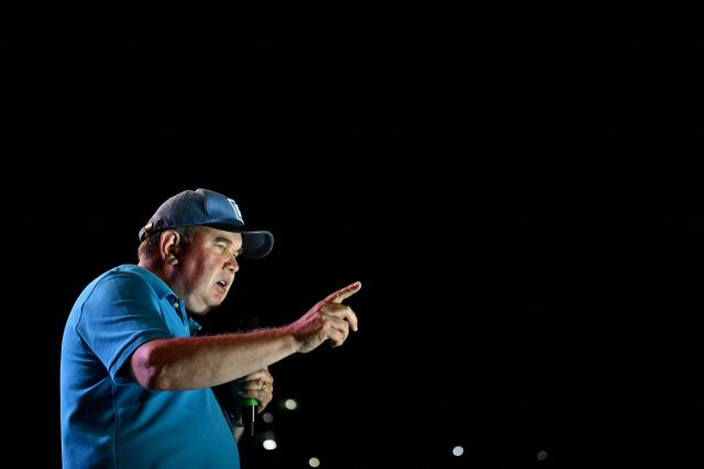Peru's presidential candidate Rafael Lopez Aliaga, for the Renovacion Popular party, speaks to supporters during his closing campaign rally in Lima on April 9, 2026. Peru will hold presidential elections on April 12. (Photo by Luis ROBAYO / AFP)