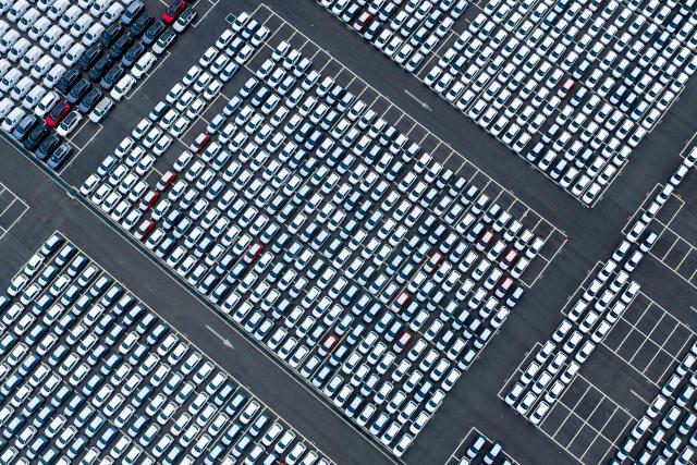 This aerial photo taken on April 9, 2026 shows cars awaiting export at Suzhou port, in China’s eastern Jiangsu province. (Photo by CN-STR / AFP) / China OUT