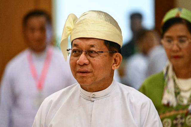 Former Myanmar military chief and Myanmar president Min Aung Hlaing arrives for a session of the Pyidaungsu Hluttaw (Union Parliament) in Naypyidaw on April 10, 2026. Myanmar junta chief Min Aung Hlaing was sworn in as president on April 10, 2026, AFP journalists saw, continuing his rule from a civilian post five years after snatching power in a coup. (Photo by Sai Aung MAIN / AFP)