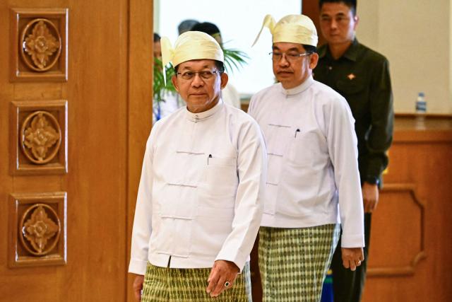 Former Myanmar military chief and Myanmar president Min Aung Hlaing arrives for a session of the Pyidaungsu Hluttaw (Union Parliament) in Naypyidaw on April 10, 2026. Myanmar junta chief Min Aung Hlaing was sworn in as president on April 10, 2026, AFP journalists saw, continuing his rule from a civilian post five years after snatching power in a coup. (Photo by Sai Aung MAIN / AFP)