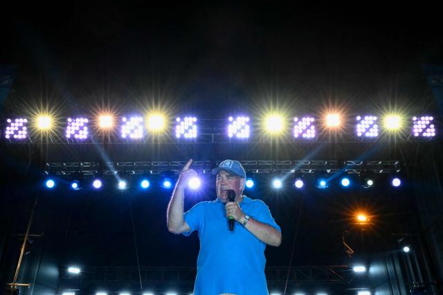 Peru's presidential candidate Rafael Lopez Aliaga, for the Renovacion Popular party, speaks to supporters during his closing campaign rally in Lima on April 9, 2026. Peru will hold presidential elections on April 12. (Photo by Luis ROBAYO / AFP)