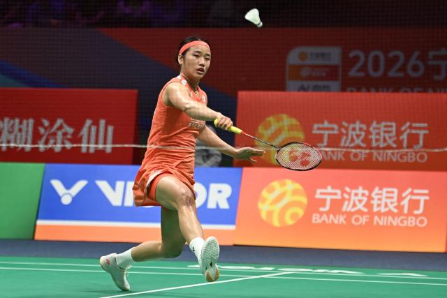 South Korea's An Se Young hits a return to Japan's Tomoka Miyazaki during their women's singles quarter-final match at the Badminton Asia Championships in Ningbo, eastern China's Zhejiang province on April 10, 2026. (Photo by CN-STR / AFP) / China OUT