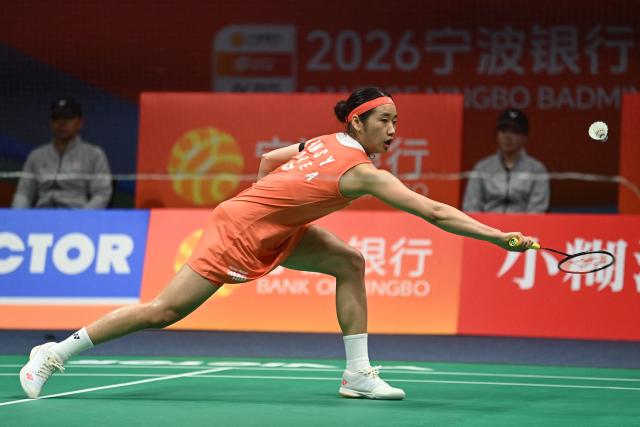 South Korea's An Se Young hits a return to Japan's Tomoka Miyazaki during their women's singles quarter-final match at the Badminton Asia Championships in Ningbo, eastern China's Zhejiang province on April 10, 2026. (Photo by CN-STR / AFP) / China OUT