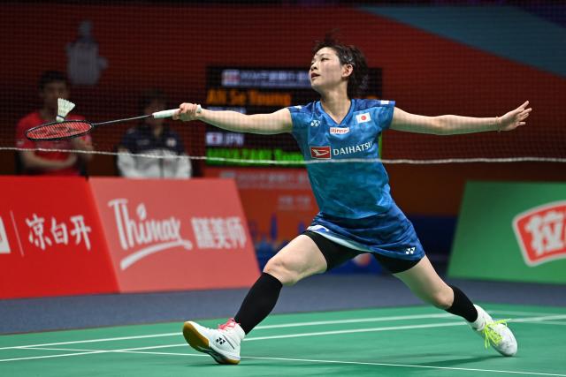 Japan's Tomoka Miyazaki hits a return to South Korea's An Se Young during their women's singles quarter-final match at the Badminton Asia Championships in Ningbo, eastern China's Zhejiang province on April 10, 2026. (Photo by CN-STR / AFP) / China OUT