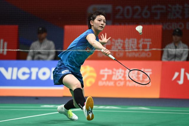 Japan's Tomoka Miyazaki hits a return to South Korea's An Se Young during their women's singles quarter-final match at the Badminton Asia Championships in Ningbo, eastern China's Zhejiang province on April 10, 2026. (Photo by CN-STR / AFP) / China OUT