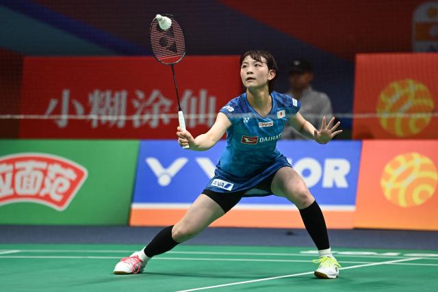 Japan's Tomoka Miyazaki hits a return to South Korea's An Se Young during their women's singles quarter-final match at the Badminton Asia Championships in Ningbo, eastern China's Zhejiang province on April 10, 2026. (Photo by CN-STR / AFP) / China OUT