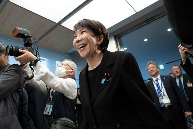 Japan’s Prime Minister Sanae Takaichi arrives at a meeting with British rock band Deep Purple (not pictured) at the Prime Minister's Office in Tokyo on April 10, 2026. (Photo by Yuichi YAMAZAKI / POOL / AFP)