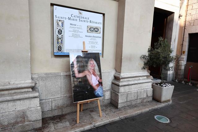This photograph depicts the first TV reality show star Loana Petrucciani waving to fans onboard a car on the Grande Armee avenue on July 5, 2001 on the last evening on the Loft Story TV broadcast, displayed ahead of her funeral ceremony in front of the cathedral of Sainte-Reparate in Nice, southeastern France where she was found dead at her home at the age of 48, on April 10, 2026. (Photo by Thibaud MORITZ / AFP)