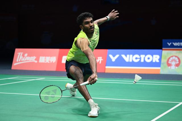 India's Ayush Shetty hits a return to Indonesia's Jonatan Christie during their men's singles quarter final match at the Badminton Asia Championship in Ningbo, eastern China's Zhejiang province on April 10, 2026. (Photo by CN-STR / AFP) / China OUT