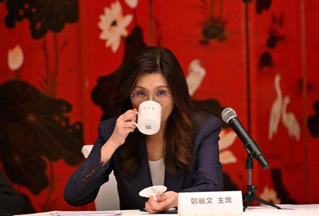Taiwan's Kuomintang Chairperson Cheng Li-wun takes a drink during a press conference in Beijing on April 10, 2026. China's President Xi Jinping met Taiwan's opposition party leader Cheng Li-wun in Beijing on April 10, telling the visiting delegation he had "full confidence" that Taiwanese and Chinese people would be united. (Photo by ADEK BERRY / AFP)