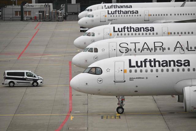 Planes operated by German airline Lufthansa sit on the tarmac at Frankfurt Airport in Frankfurt am Main, on April 10, 2026 as cabin crews went on strike over an ongoing labour dispute. (Photo by Kirill KUDRYAVTSEV / AFP)