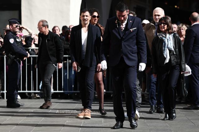 French tv host Steevy Boulay (C), CEO of Banijay Entertainment Alexia Laroche-Joubert (R) and Loft Story ex-competitor Julie Mercy (C-R) arrive to attend the funeral ceremony of Loana Petrucciani, the first reality TV star in France, at the cathedral of Sainte-Reparate in Nice, southeastern France where she was found dead at her home at the age of 48, on April 10, 2026. (Photo by Thibaud MORITZ / AFP)