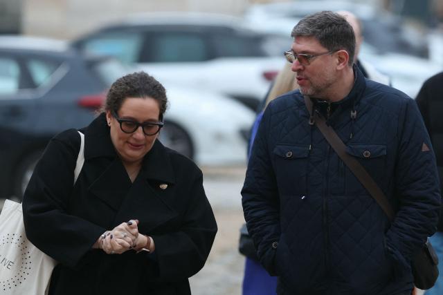 (FILES) Evaelle's parents arrive for the appeal trial of a teacher for harassment after Evaelle, a 11 year-old-middle school student committed suicide, at Versailles courthouse, on February 9, 2026. The appeal was requested by the public prosecutor, who had sought an 18-month suspended prison sentence for Evaelle's teacher. The schoolgirl hanged herself in her bedroom at her family home in Herblay in June 2019. The court's judgement is expected on April 13, 2026. (Photo by Alain JOCARD / AFP)