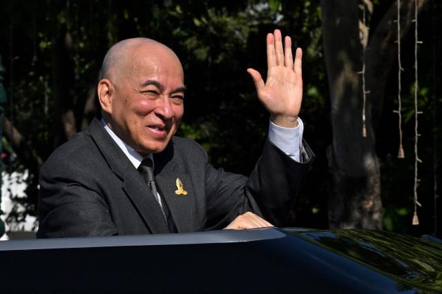 (FILES) Cambodia's King Norodom Sihamoni greets people at the Independence Monument during a ceremony marking Cambodia's 71st Independence Day celebrations in Phnom Penh on November 9, 2024. Cambodia's King Norodom Sihamoni has been diagnosed with prostate cancer, he said in a statement on April 10, 2026, and will stay in China for prolonged treatment for the disease. (Photo by TANG CHHIN Sothy / AFP)
