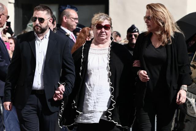Violette Petrucciani (C), mother of Loana, arrives to attend the funeral ceremony of Loana Petrucciani, the first reality TV star in France, at the cathedral of Sainte-Reparate in Nice, southeastern France where she was found dead at her home at the age of 48, on April 10, 2026. (Photo by Thibaud MORITZ / AFP)