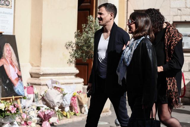 French tv host Steevy Boulay (L), CEO of Banijay Entertainment Alexia Laroche-Joubert and Loft Story ex-competitor Julie Mercy (R) arrive to attend the funeral ceremony of Loana Petrucciani, the first reality TV star in France, at the cathedral of Sainte-Reparate in Nice, southeastern France where she was found dead at her home at the age of 48, on April 10, 2026. (Photo by Thibaud MORITZ / AFP)