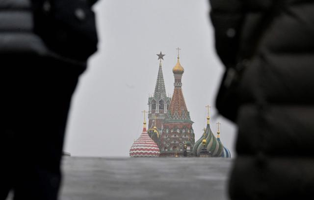 Pedestrians walk in front of St. Basil's cathedral in downtown Moscow on April 10, 2026. (Photo by Alexander NEMENOV / AFP)